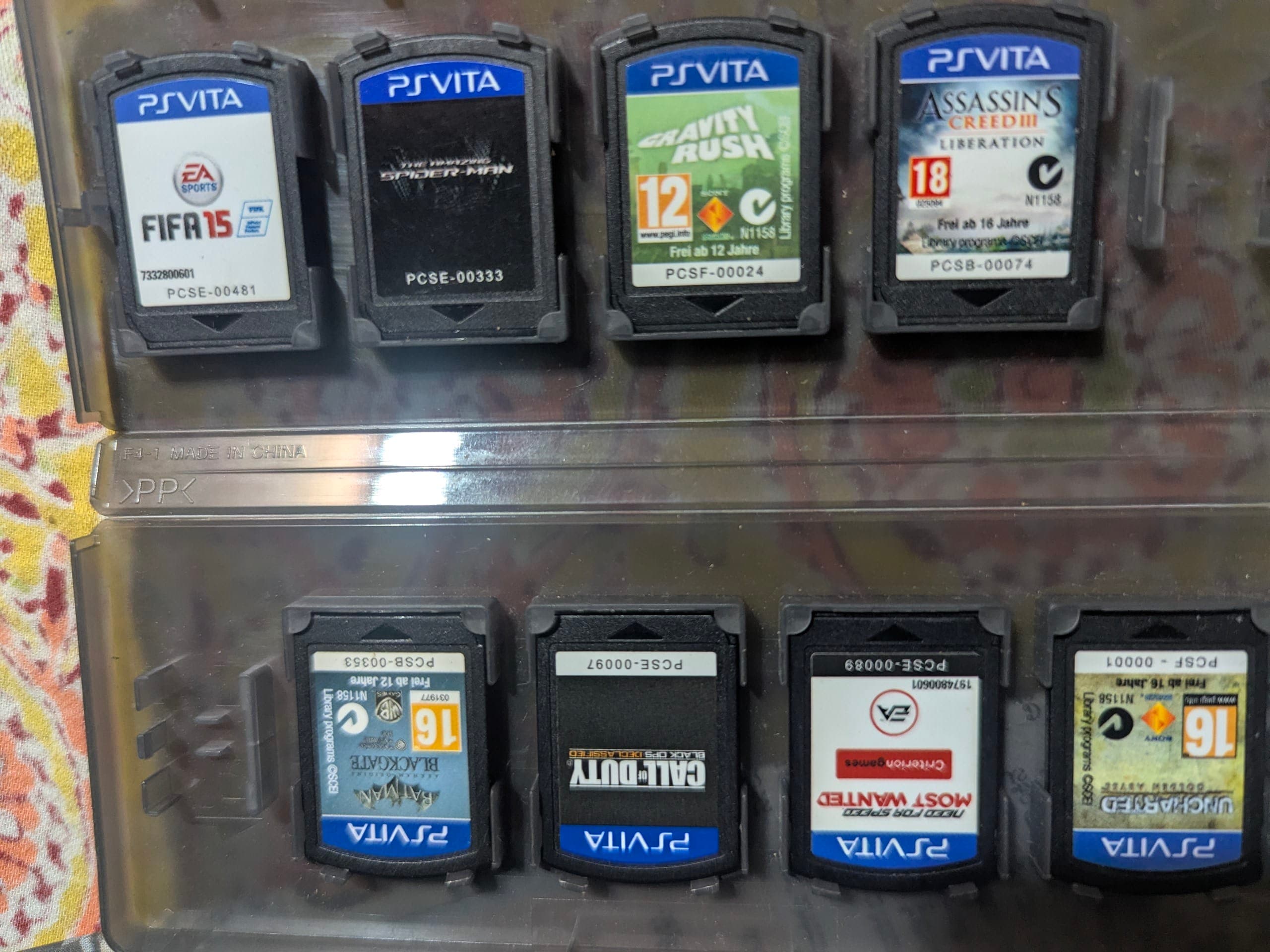 A collection of PS Vita game cases arranged together