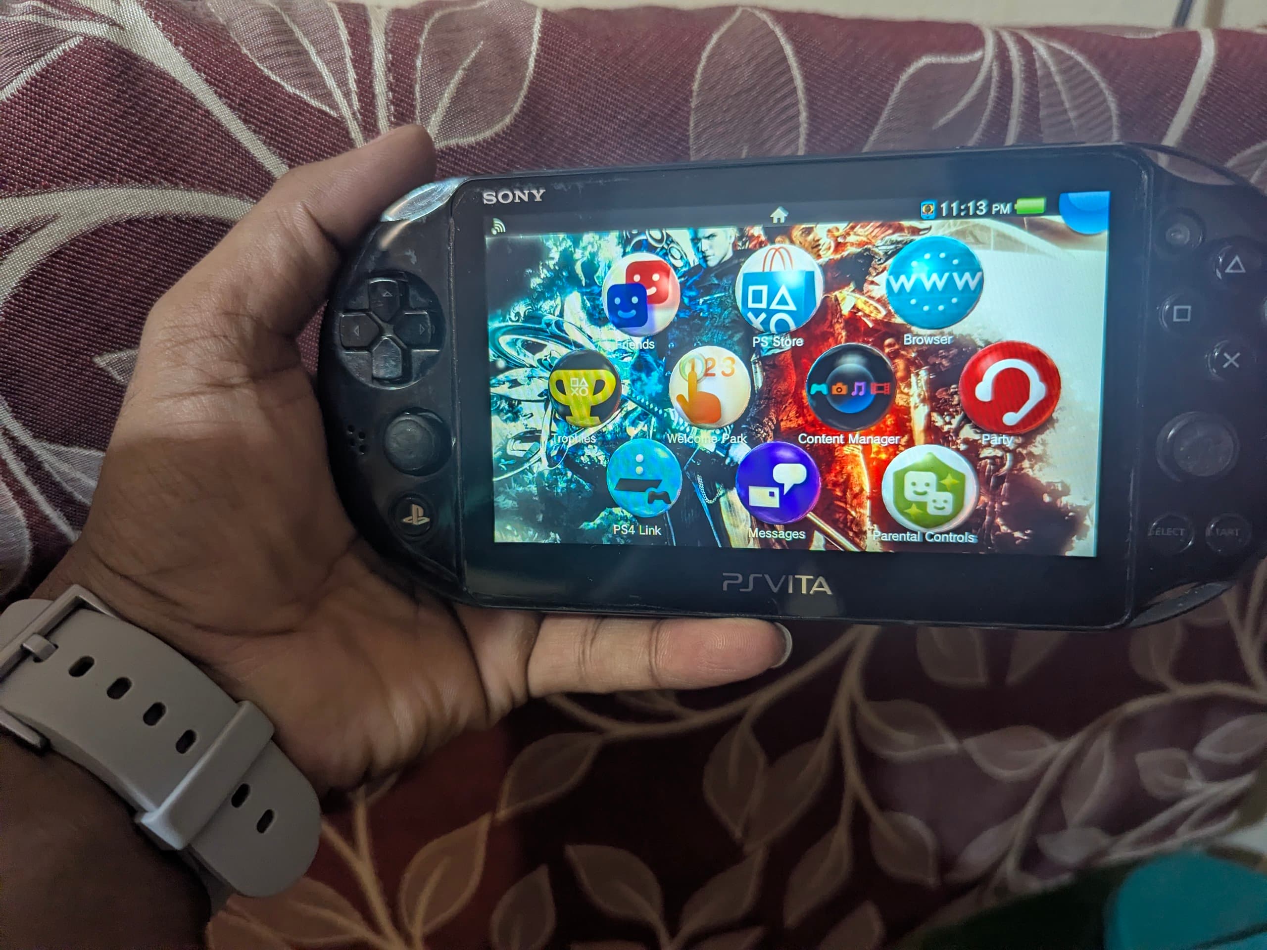 PS Vita Slim resting on a surface showing its compact and slim design