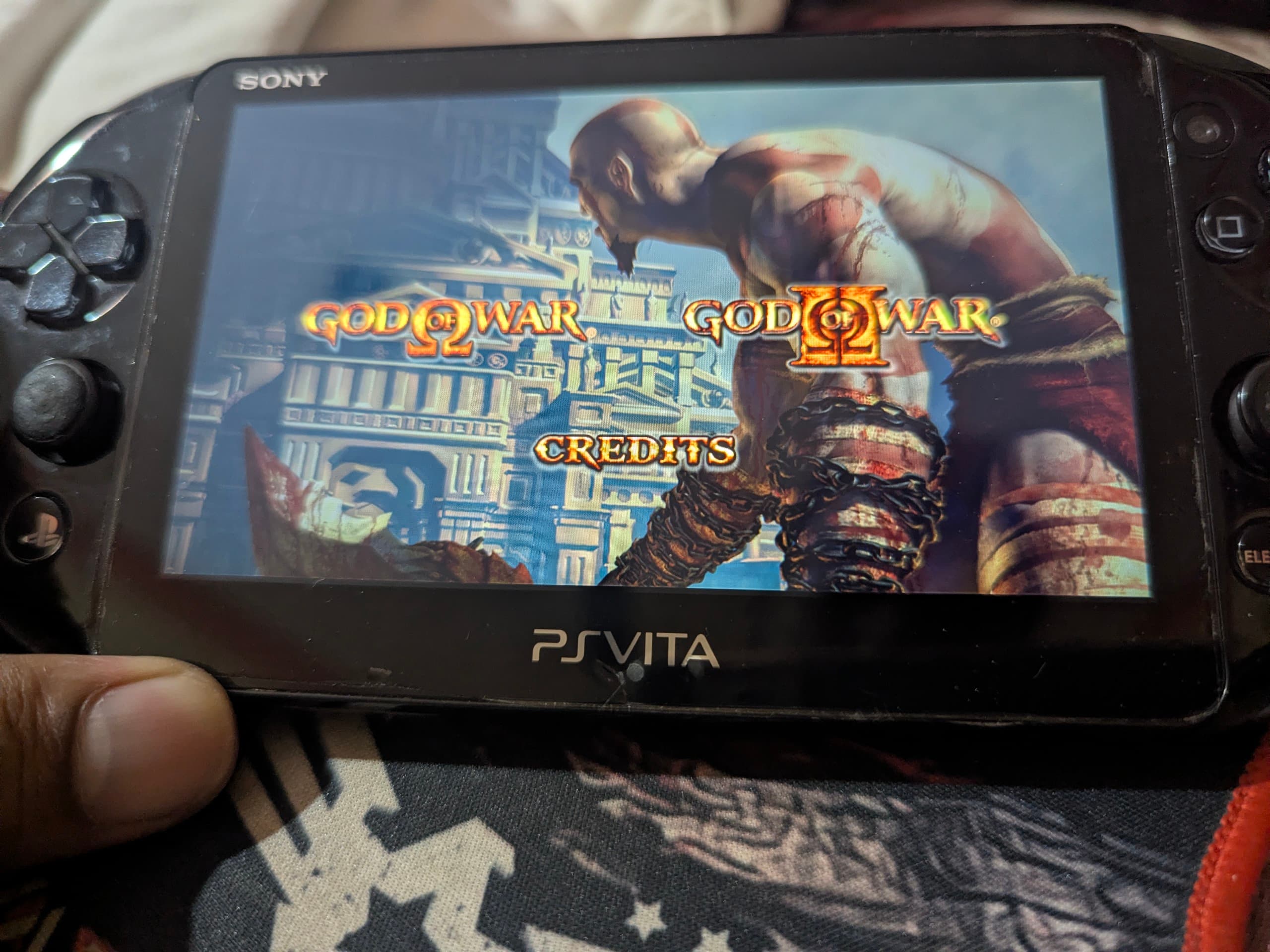 Close-up of the PS Vita Slim showing the screen and button layout