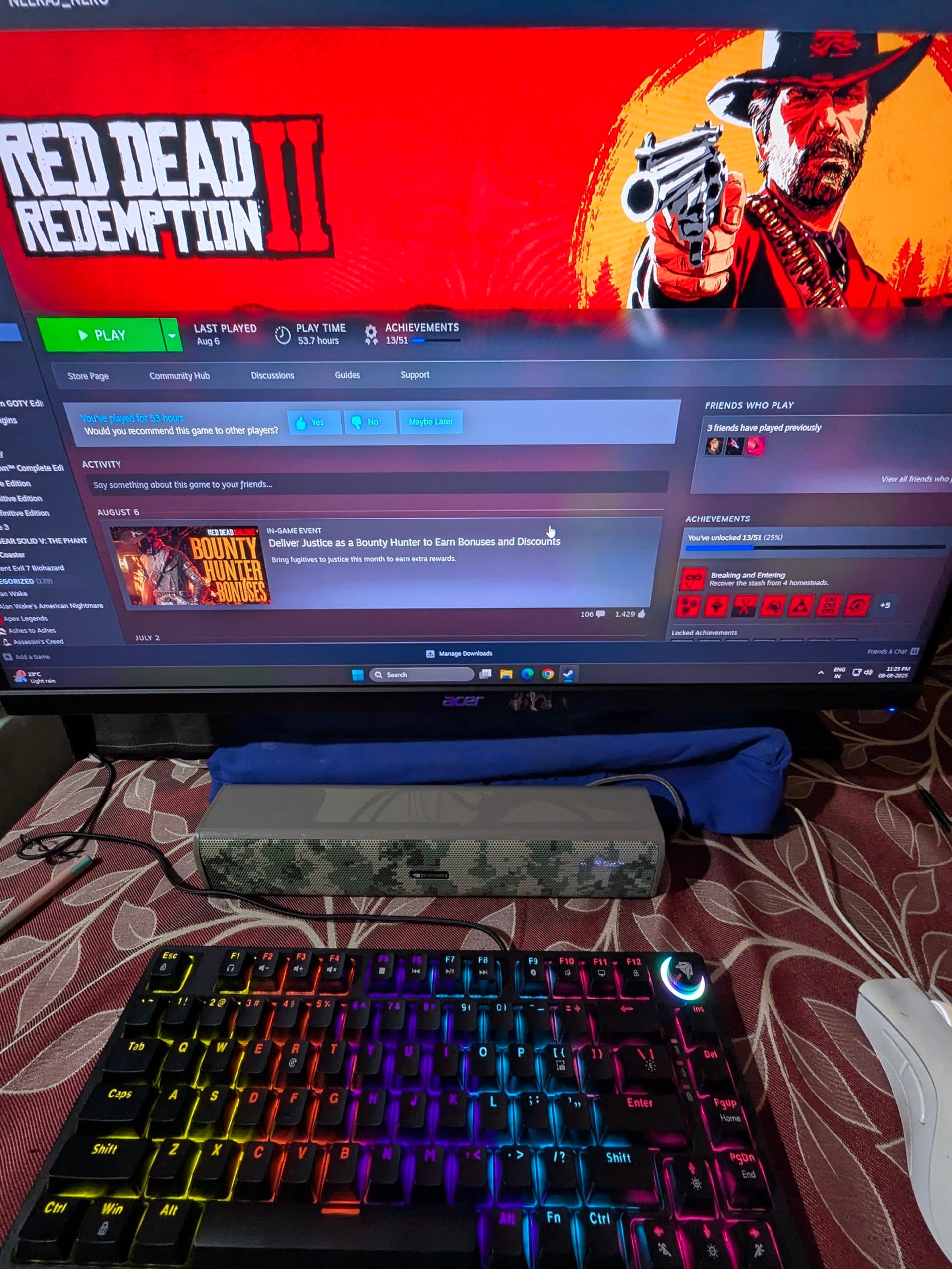 PC gaming setup with Steam on monitor